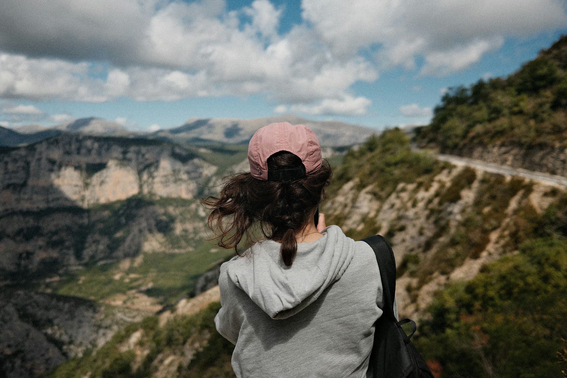 Woman looking at a vast mountain landscape